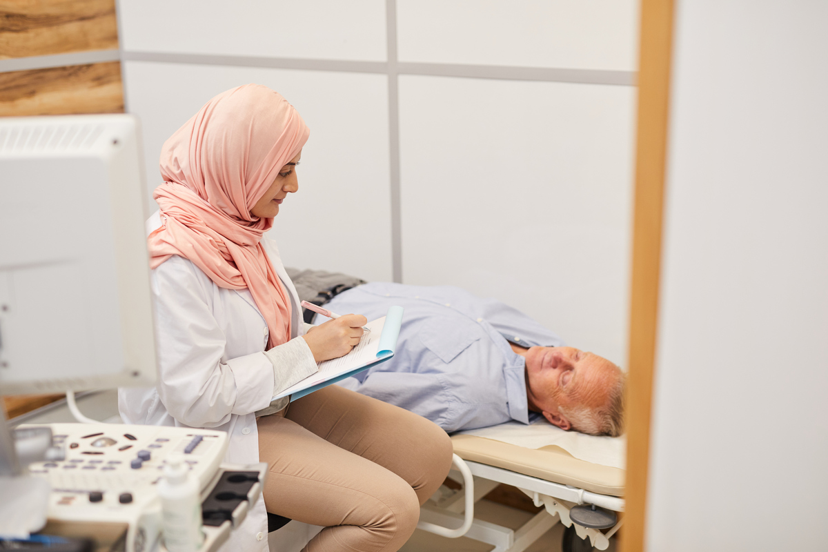 doctor checking in on a patient with sleeping issues