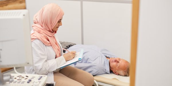 doctor checking in on a patient with sleeping issues